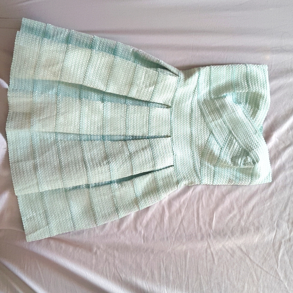 L'Atiste mint green bandage style cocktail dress.